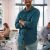 portrait-of-young-smiling-businessman-standing-in-2026-03-20-04-11-21-utc-scaled.jpg